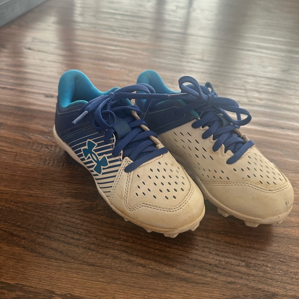 Under Armour Blue and white baseball cleats 13K